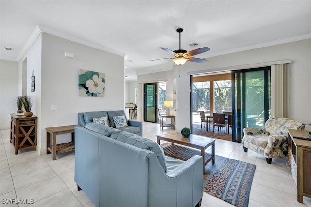 living area with crown molding, light tile patterned flooring, and ceiling fan