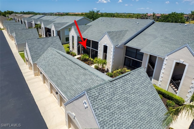 12130 Kelly Greens Blvd Unit 91, Fort Myers, FL 33908 - drone / aerial view featuring a residential view