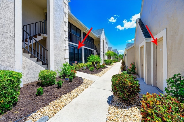12130 Kelly Greens Blvd Unit 91, Fort Myers, FL 33908 - view of property's community with stairs and a residential view