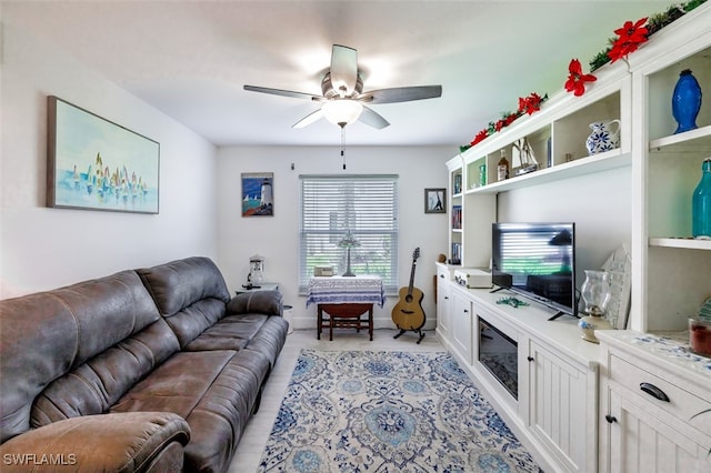 12130 Kelly Greens Blvd Unit 91, Fort Myers, FL 33908 - living area featuring baseboards and a ceiling fan