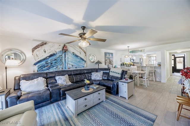 12130 Kelly Greens Blvd Unit 91, Fort Myers, FL 33908 - living area featuring light wood-type flooring and ceiling fan