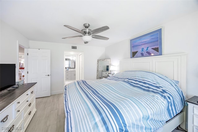 12130 Kelly Greens Blvd Unit 91, Fort Myers, FL 33908 - bedroom with ensuite bathroom, visible vents, and ceiling fan