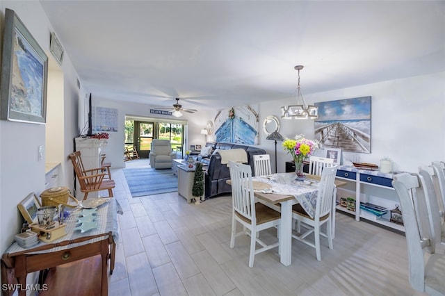12130 Kelly Greens Blvd Unit 91, Fort Myers, FL 33908 - dining area with visible vents and ceiling fan with notable chandelier