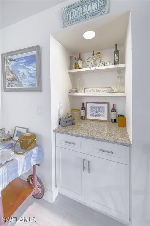 12130 Kelly Greens Blvd Unit 91, Fort Myers, FL 33908 - bar with a dry bar and tile patterned flooring