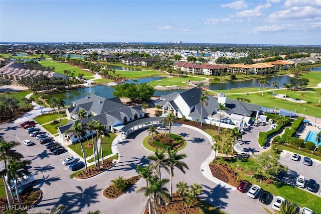 12130 Kelly Greens Blvd Unit 91, Fort Myers, FL 33908 - drone / aerial view with view of golf course, a water view, and a residential view