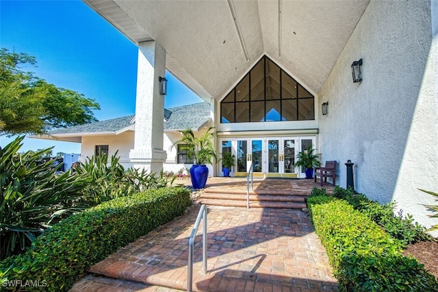 12130 Kelly Greens Blvd Unit 91, Fort Myers, FL 33908 - entrance to property with stucco siding and french doors