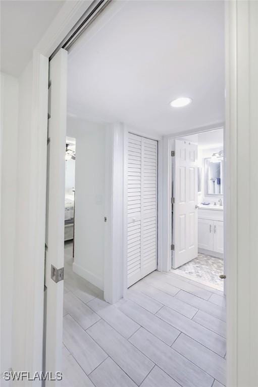 12130 Kelly Greens Blvd Unit 91, Fort Myers, FL 33908 - corridor featuring wood finish floors