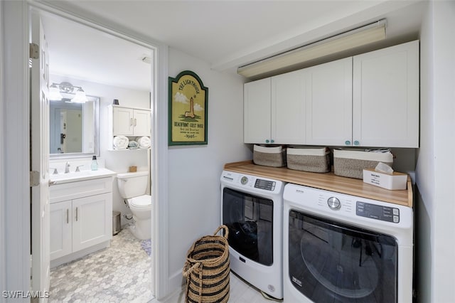 12130 Kelly Greens Blvd Unit 91, Fort Myers, FL 33908 - washroom with a sink, cabinet space, and independent washer and dryer