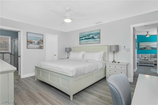 7666 Laurel Valley Rd, Fort Myers, FL 33967 - bedroom with light wood-style flooring, baseboards, and a ceiling fan