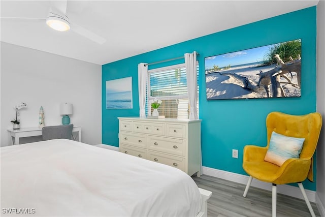 7666 Laurel Valley Rd, Fort Myers, FL 33967 - bedroom featuring wood finished floors, baseboards, and a ceiling fan