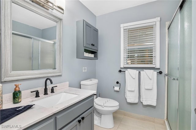 7666 Laurel Valley Rd, Fort Myers, FL 33967 - bathroom featuring a stall shower, vanity, toilet, tile patterned flooring, and baseboards