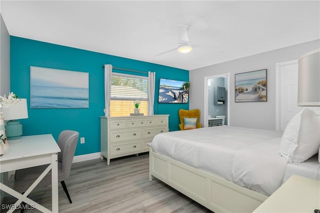 7666 Laurel Valley Rd, Fort Myers, FL 33967 - bedroom with light wood-style flooring, an office area, ceiling fan, and connected bathroom