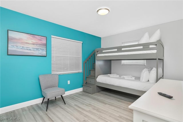 7666 Laurel Valley Rd, Fort Myers, FL 33967 - bedroom featuring light wood-style flooring and baseboards