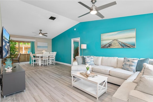 7666 Laurel Valley Rd, Fort Myers, FL 33967 - living room with a ceiling fan, vaulted ceiling, wood finished floors, and baseboards