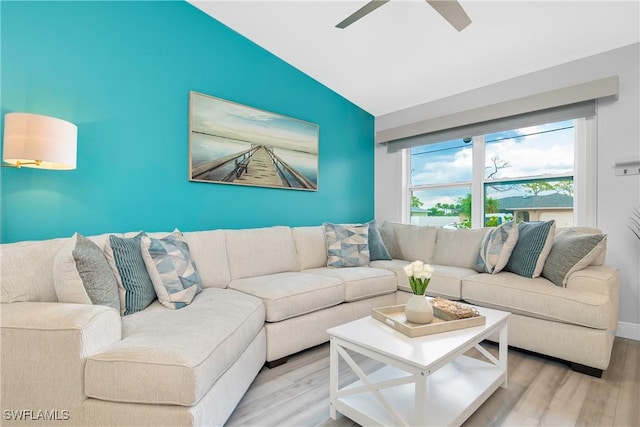 7666 Laurel Valley Rd, Fort Myers, FL 33967 - living room with lofted ceiling, light wood finished floors, a ceiling fan, and baseboards