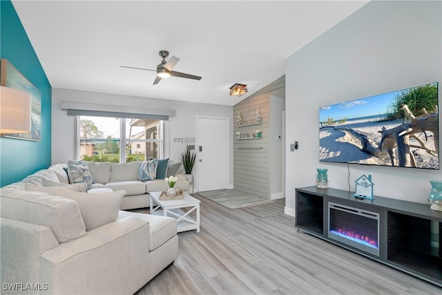 7666 Laurel Valley Rd, Fort Myers, FL 33967 - living area featuring wood finished floors, a ceiling fan, baseboards, vaulted ceiling, and wood walls