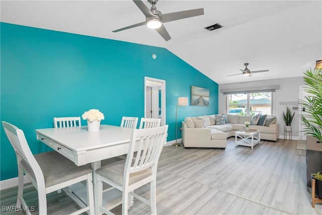 7666 Laurel Valley Rd, Fort Myers, FL 33967 - dining room featuring ceiling fan, vaulted ceiling, baseboards, and wood finished floors