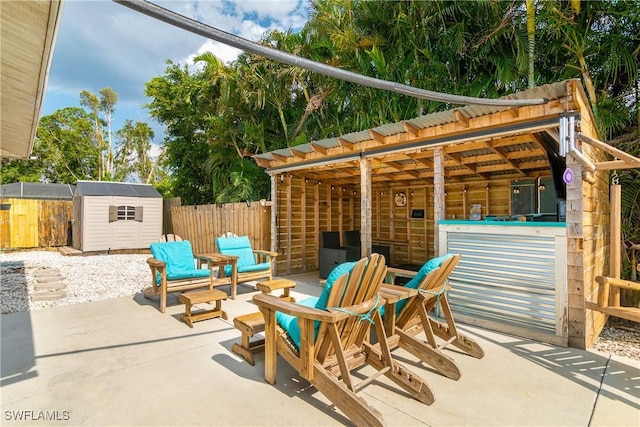 7666 Laurel Valley Rd, Fort Myers, FL 33967 - view of patio featuring a shed, an outdoor structure, and fence