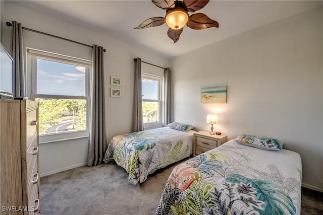bedroom with carpet floors, baseboards, and a ceiling fan