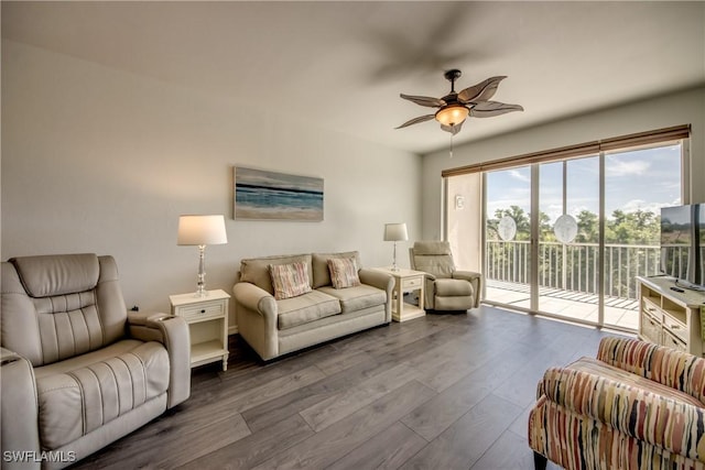 living room featuring wood finished floors and a ceiling fan