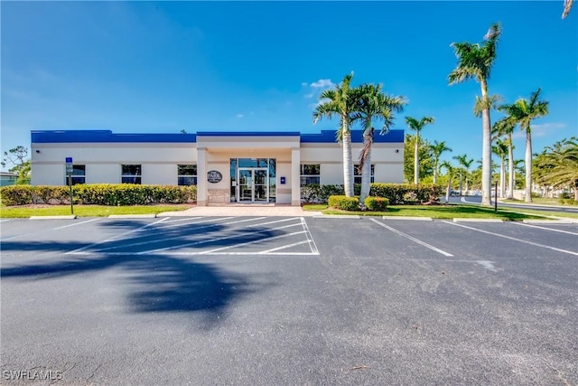view of property with uncovered parking