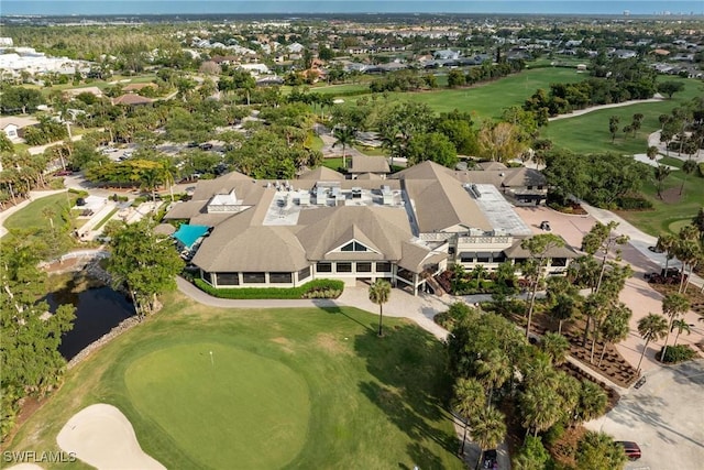 bird's eye view with a residential view, view of golf course, and a water view