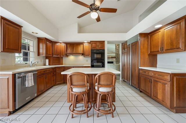 kitchen with lofted ceiling, premium range hood, light countertops, a sink, and dishwasher
