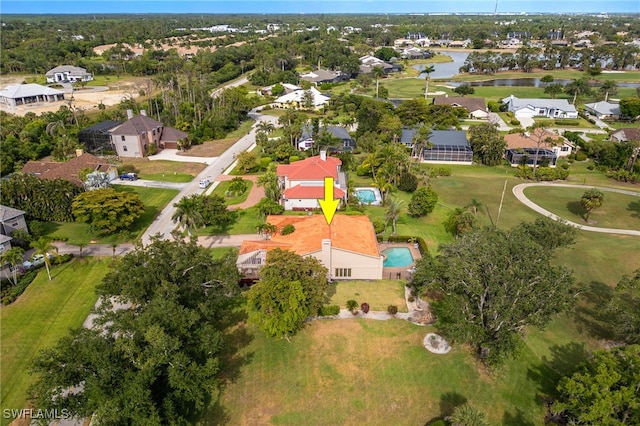 aerial view with a residential view and a water view