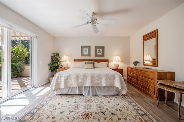 bedroom featuring baseboards, access to exterior, ceiling fan, and light wood finished floors
