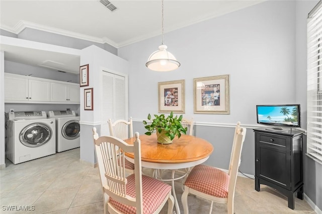 dining space with washing machine and clothes dryer, ornamental molding, light tile patterned floors, and baseboards