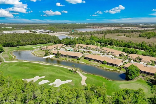 drone / aerial view of a nearby body of water and a golf club