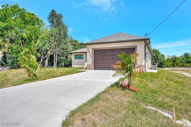 3518 50th St W, Lehigh Acres, FL 33971 - view of front of home featuring a front lawn, a garage, stucco siding, central AC unit, and driveway