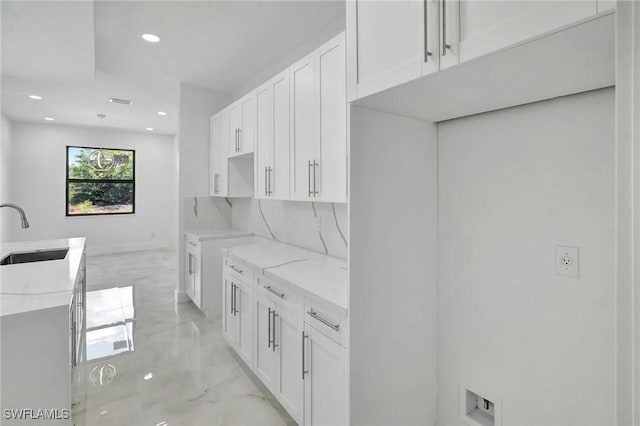 3518 50th St W, Lehigh Acres, FL 33971 - kitchen featuring a sink, white cabinets, recessed lighting, and marble finish floor
