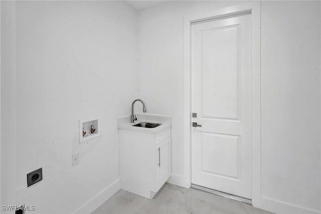 3518 50th St W, Lehigh Acres, FL 33971 - clothes washing area featuring baseboards, hookup for a washing machine, electric dryer hookup, a sink, and cabinet space