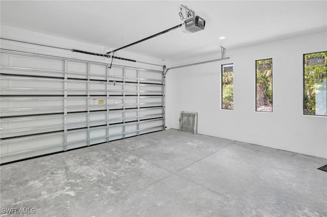 3518 50th St W, Lehigh Acres, FL 33971 - garage featuring a garage door opener