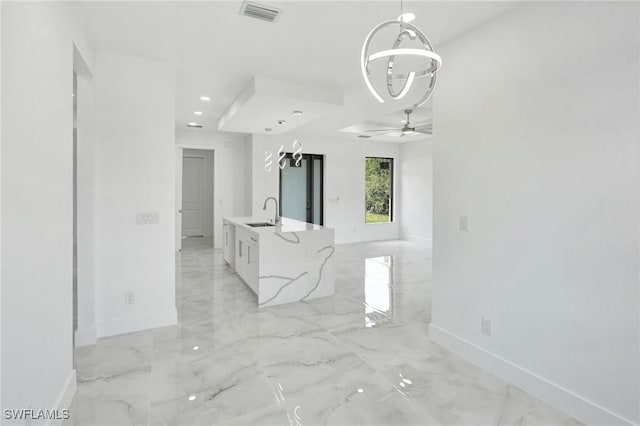 3518 50th St W, Lehigh Acres, FL 33971 - interior space featuring baseboards, visible vents, a sink, and marble finish floor