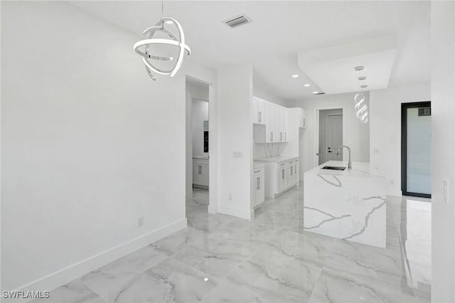 3518 50th St W, Lehigh Acres, FL 33971 - interior space featuring visible vents, a sink, baseboards, marble finish floor, and recessed lighting