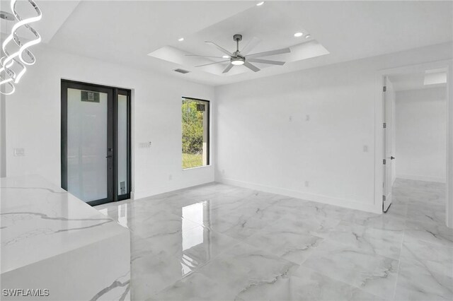 3518 50th St W, Lehigh Acres, FL 33971 - unfurnished room featuring a ceiling fan, a tray ceiling, recessed lighting, and marble finish floor