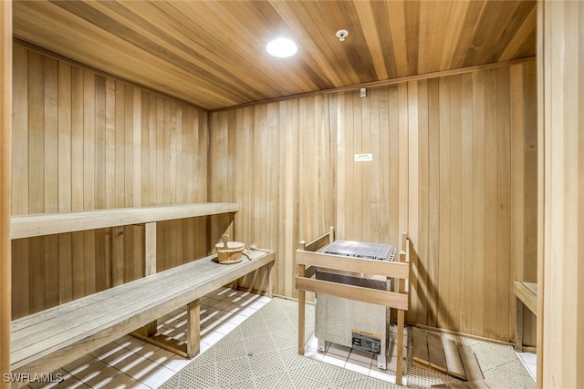 1050 Borghese Ln Unit 206, Naples, FL 34114 - sauna with wooden ceiling, wooden walls, and tile patterned floors