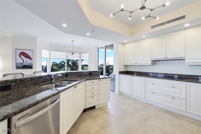 1050 Borghese Ln Unit 206, Naples, FL 34114 - kitchen featuring a chandelier, dishwasher, a sink, dark stone countertops, and white cabinetry