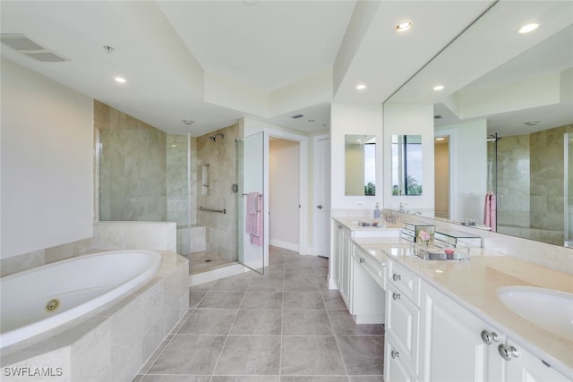 1050 Borghese Ln Unit 206, Naples, FL 34114 - bathroom featuring a stall shower, a bath, recessed lighting, double vanity, and baseboards