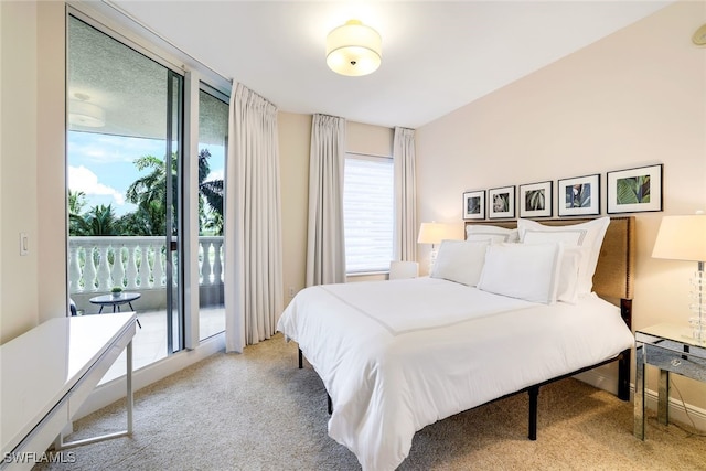 1050 Borghese Ln Unit 206, Naples, FL 34114 - bedroom with light colored carpet and access to exterior