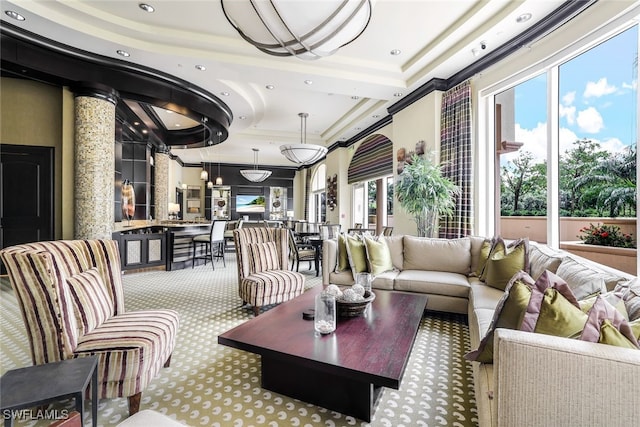 1050 Borghese Ln Unit 206, Naples, FL 34114 - living room with a tray ceiling, carpet, recessed lighting, and crown molding