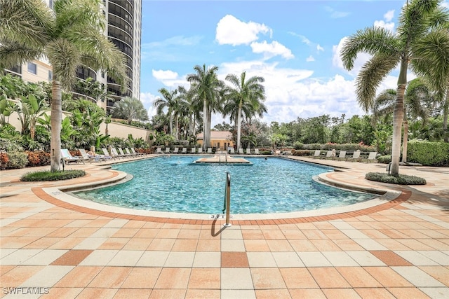1050 Borghese Ln Unit 206, Naples, FL 34114 - community pool with a patio area