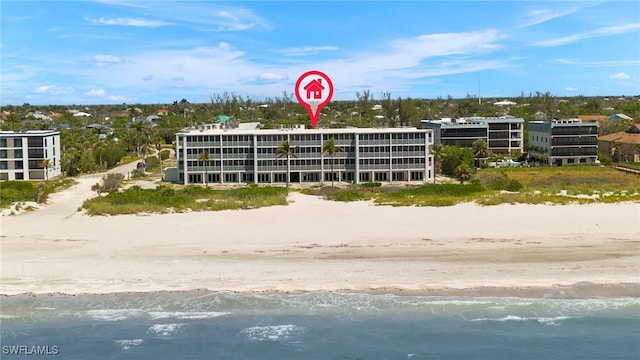 aerial view featuring a view of the beach and a water view
