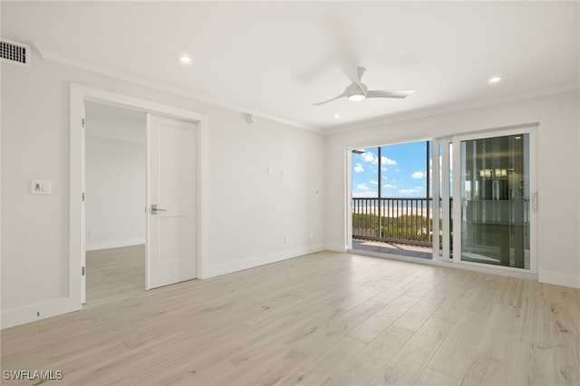 unfurnished room with ornamental molding, visible vents, light wood-style flooring, and ceiling fan