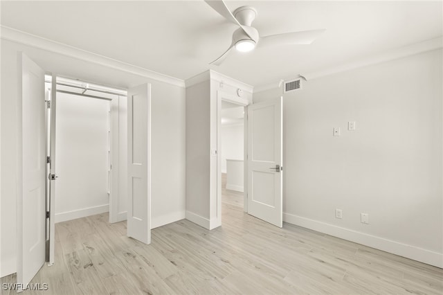 unfurnished bedroom with baseboards, a closet, visible vents, and light wood-style floors