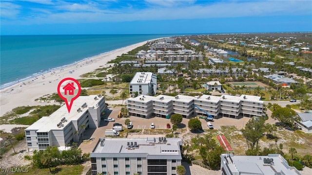 aerial view with a water view and a view of the beach