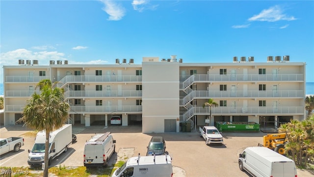 view of property featuring uncovered parking