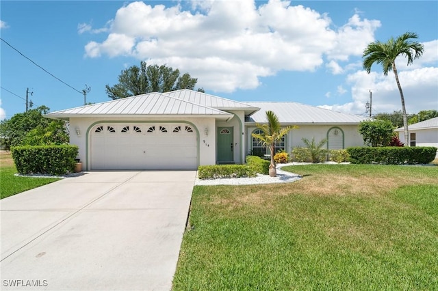 914 SW 3rd Ave, Cape Coral, FL 33991 - single story home with stucco siding, driveway, a garage, and a front yard